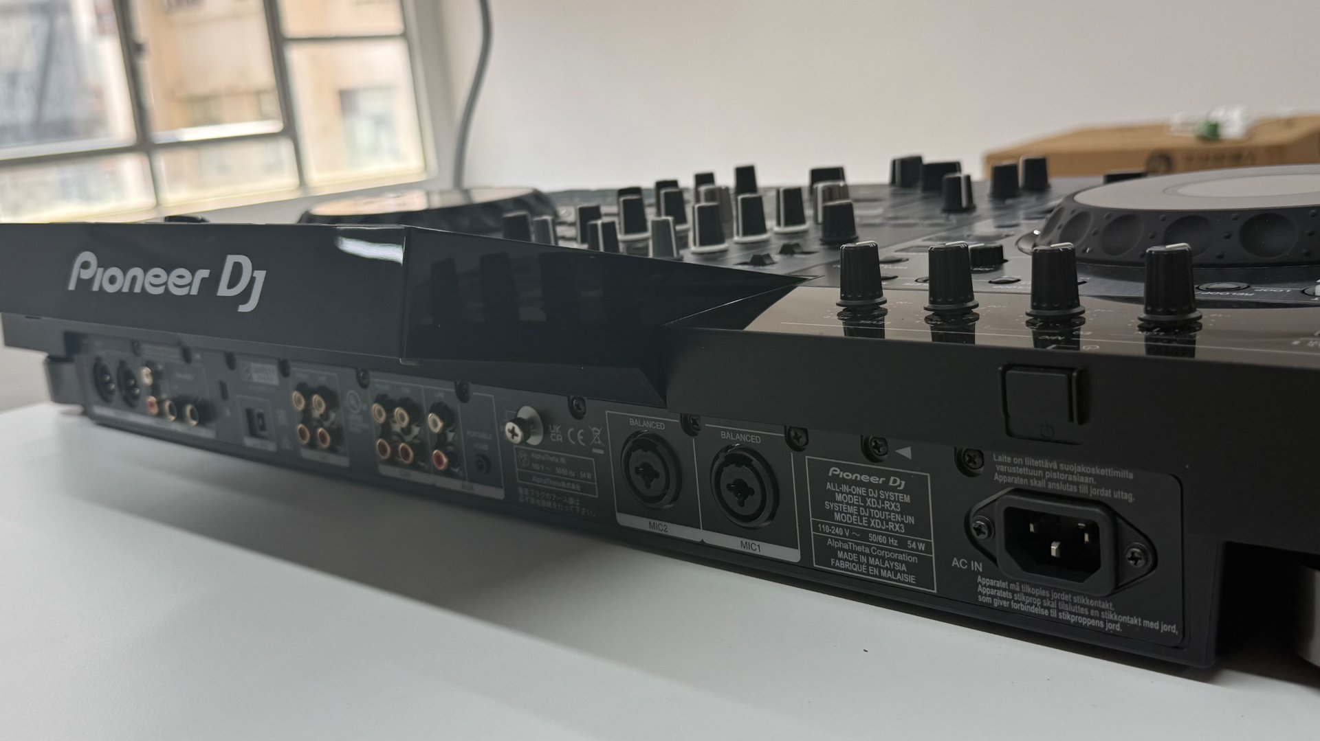Angled view of the DJ console rear panel and audio connectors